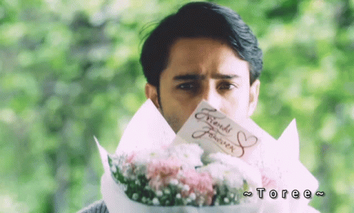 Man Holding Bouquet and Friends Forever Card