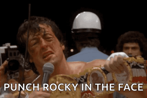 Man Holding Boxing Ring Saying Punch Rocky in the Face
