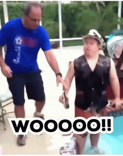 Man Holding Boy In Swimming Pool With Life Vest And Hat GIF
