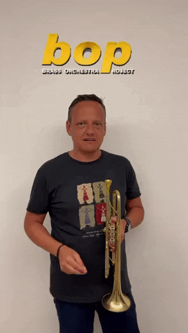 Man Holding Brass Orchestra Instruments Notti Bop GIF