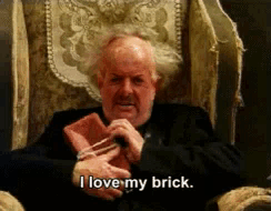 Man Holding Brick Saying I Love My Brick