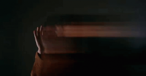 Man Holding Burning Log in Office