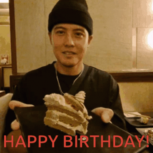 Man Holding Cake with Happy Birthday in Red