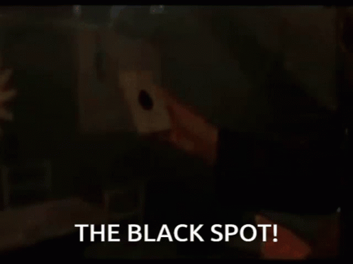 Man Holding Candle Saying The Black Spot