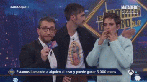 Man Holding Card Saying Estamos Llamando