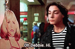 Man Holding Cardboard Cutout Saying Oh Debbie Hi