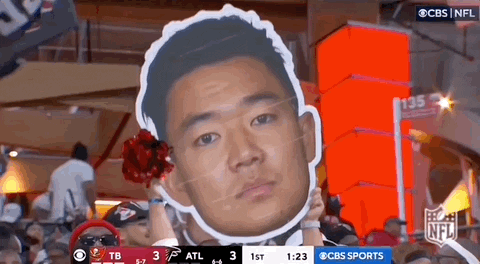 Man Holding Cardboard Face Cutout
