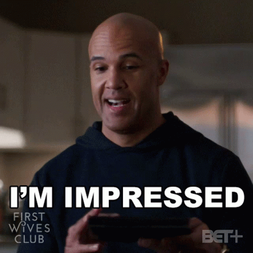 Man Holding Cell Phone Saying I'm Impressed