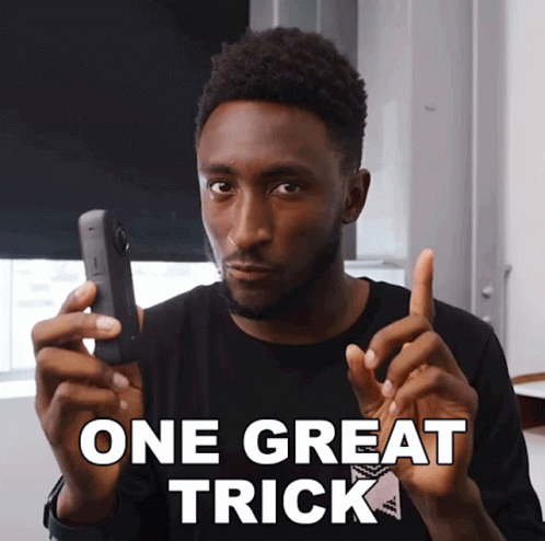 Man Holding Cell Phone Saying One Great Trick