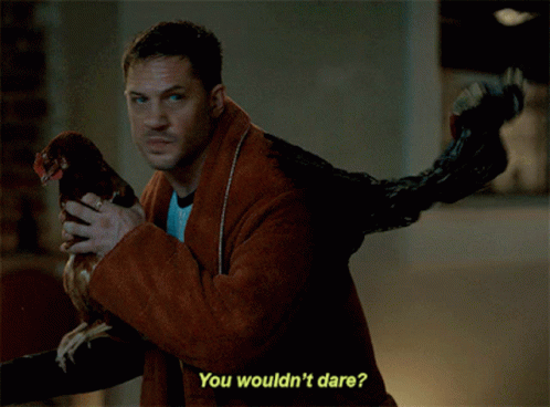 Man Holding Chicken Dare Caption