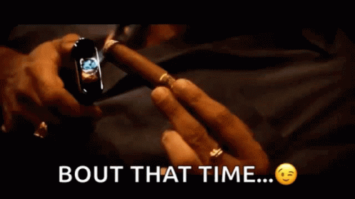 Man Holding Cigar With Bout That Time