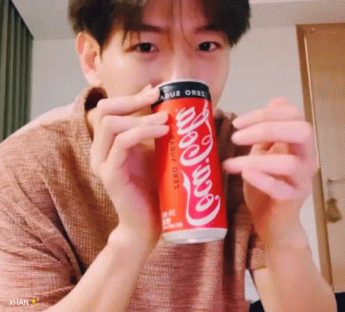 Man Holding Coca Cola Zero Can