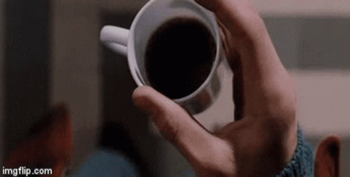 Man Holding Cup of Coffee
