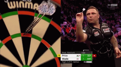 Man Holding Dart in Front of Dartboard Saying Winma