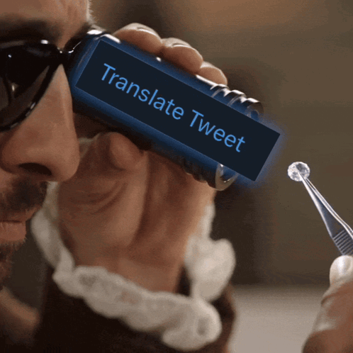 Man Holding Device Saying Translate Tweet