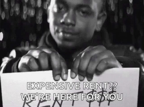 Man Holding Expensive Rent Sign GIF