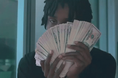 Man Holding Fan of Fifty Dollar Bills