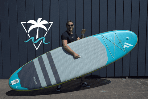 Man Holding Fanatic Paddle Board