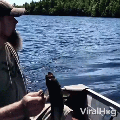 Man Holding Fish In Boat Viralhog GIF