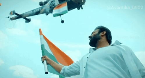 Man Holding Flag Near Helicopter Saying Army GIF