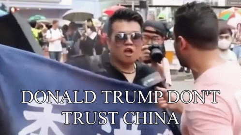 Man Holding Flag Saying Don't Trust China