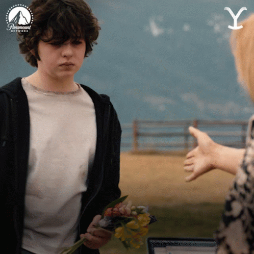 Man Holding Flowers And Paramount Network Logo GIF