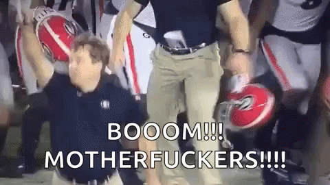 Man Holding Football Saying Booom Motherfuckers