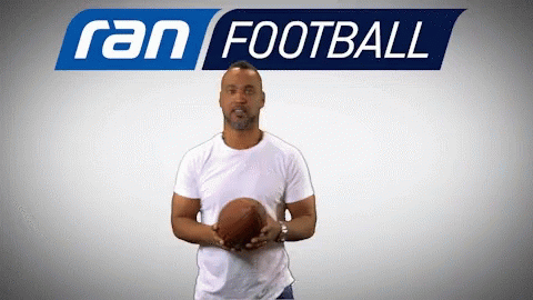 Man Holding Football Saying Ran Football