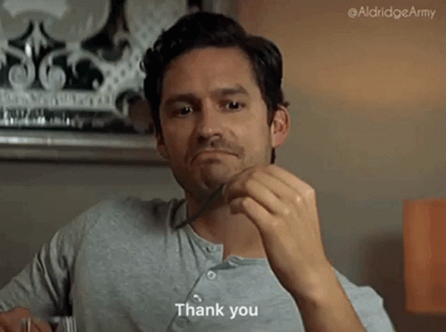 Man Holding Fork in Mouth Saying Thank You