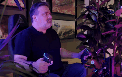 Man Holding Genesis Controller