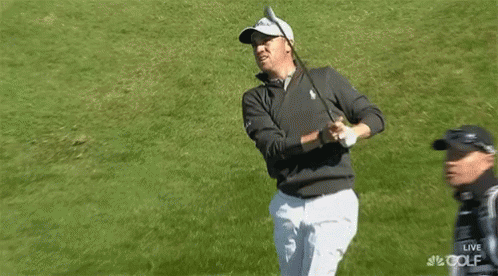 Man Holding Golf Club Talking