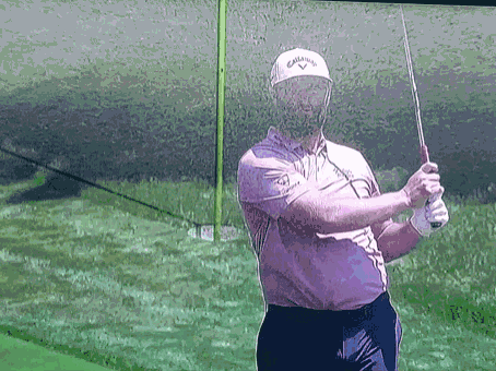 Man Holding Golf Club Wearing Callaway Hat