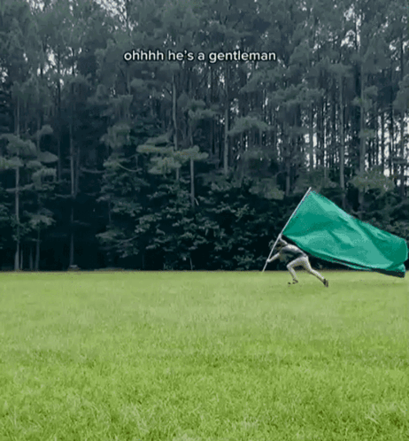 Man Holding Green Flag Oh He's a Gentleman