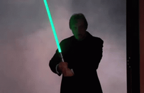 Man Holding Green Light Saber