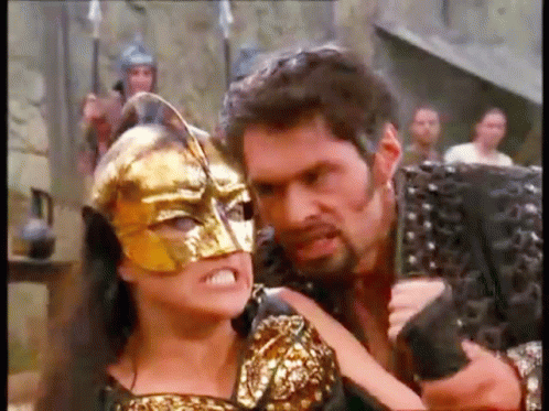 Man Holding Gun and Woman Wearing Mask