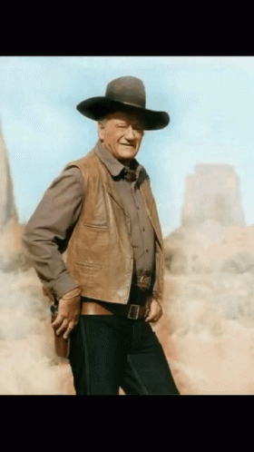 Man Holding Gun Cowboy Hat Leather Vest