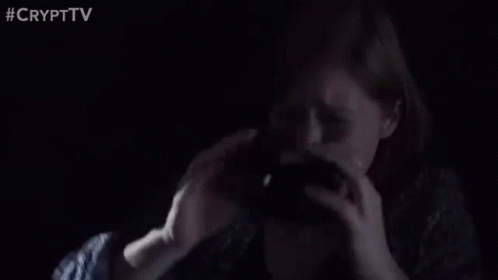 Man Holding Gun In Dark Room GIF