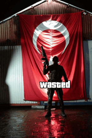 Man Holding Gun In Front Of Wasted Flag GIF