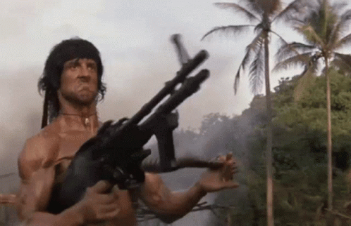 Man Holding Gun in Jungle
