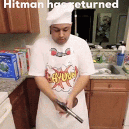 Man Holding Gun in Kitchen Hitman Has Returned