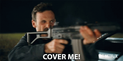 Man Holding Gun Saying Cover Me