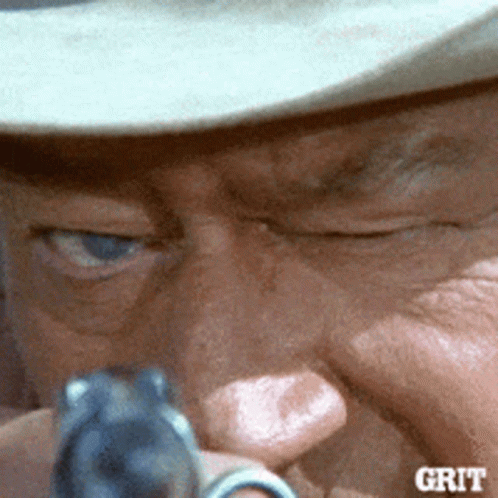 Man Holding Gun Saying Grit