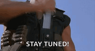 Man Holding Gun Saying Stay Tuned