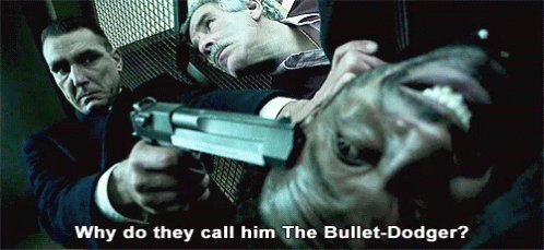 Man Holding Gun Saying Why Do They Call Him the Bullet-Dodge