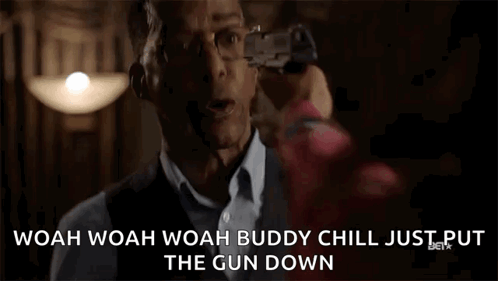 Man Holding Gun Saying Woah Chill