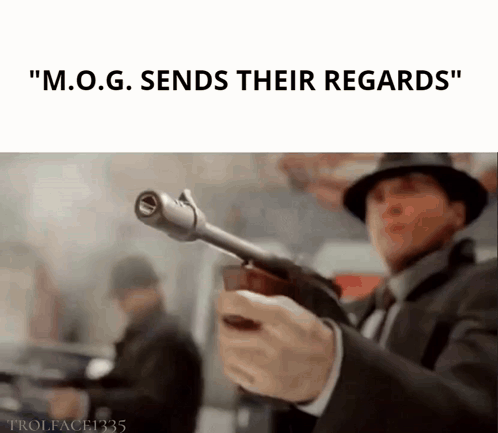 Man Holding Gun Says M.O.G. Sends Their Regards