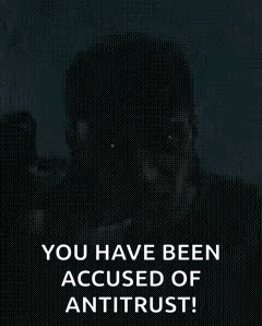 Man Holding Gun Says You Have Been Accused Of Antitrust! GIF