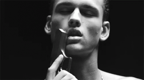 Man Holding Gun To Face GIF