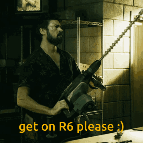Man Holding Hammer Get on R6 Please