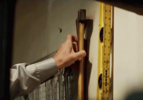 Man Holding Hammer Next To Yellow Ruler Saying Maven GIF